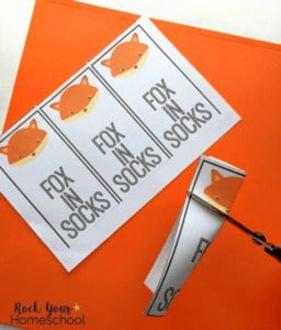 scissors cutting a small line in the bookmark