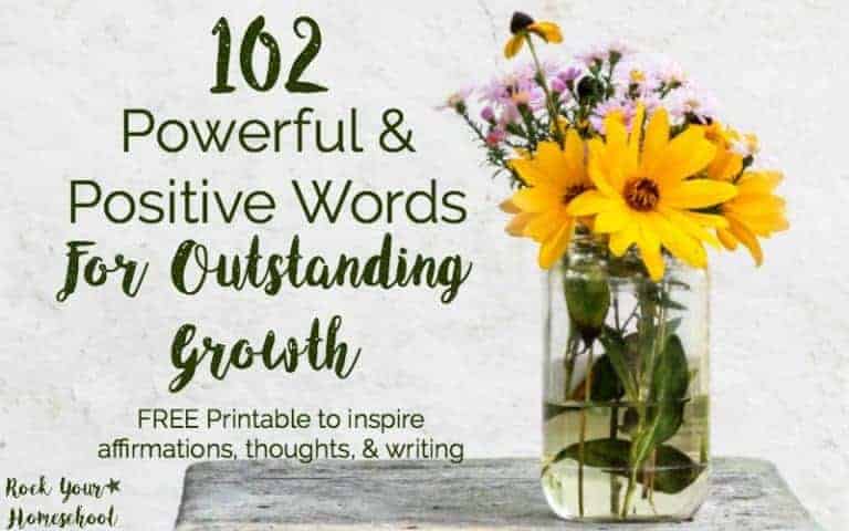 A glass vase of flowers sitting on a table to feature these 102 powerful and positive words for outstanding growth