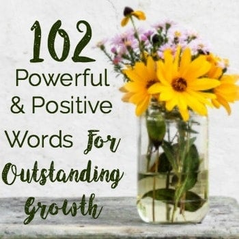 A close up of flowers in a glass vase to feature these 102 powerful and positive words for outstanding growth