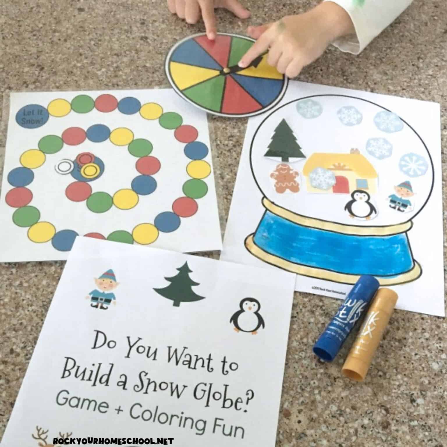 Boy using spinner to play Do You Want to Build a Snow Globe? game for fun winter activity for kids.