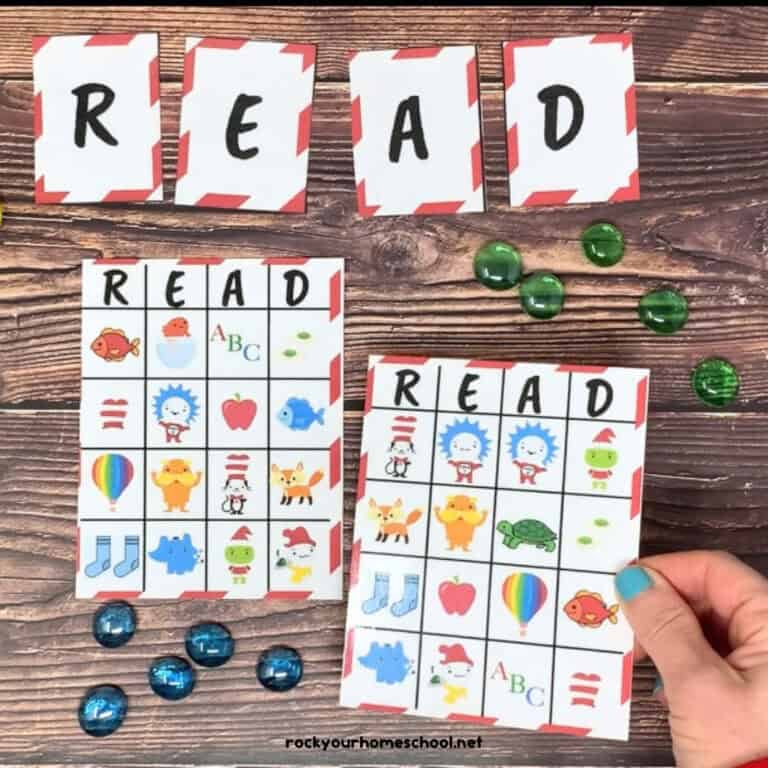 Woman holding free printable Dr. Seuss-Inspired bingo game to play R-E-A-D with Dr. Seuss characters and markers.