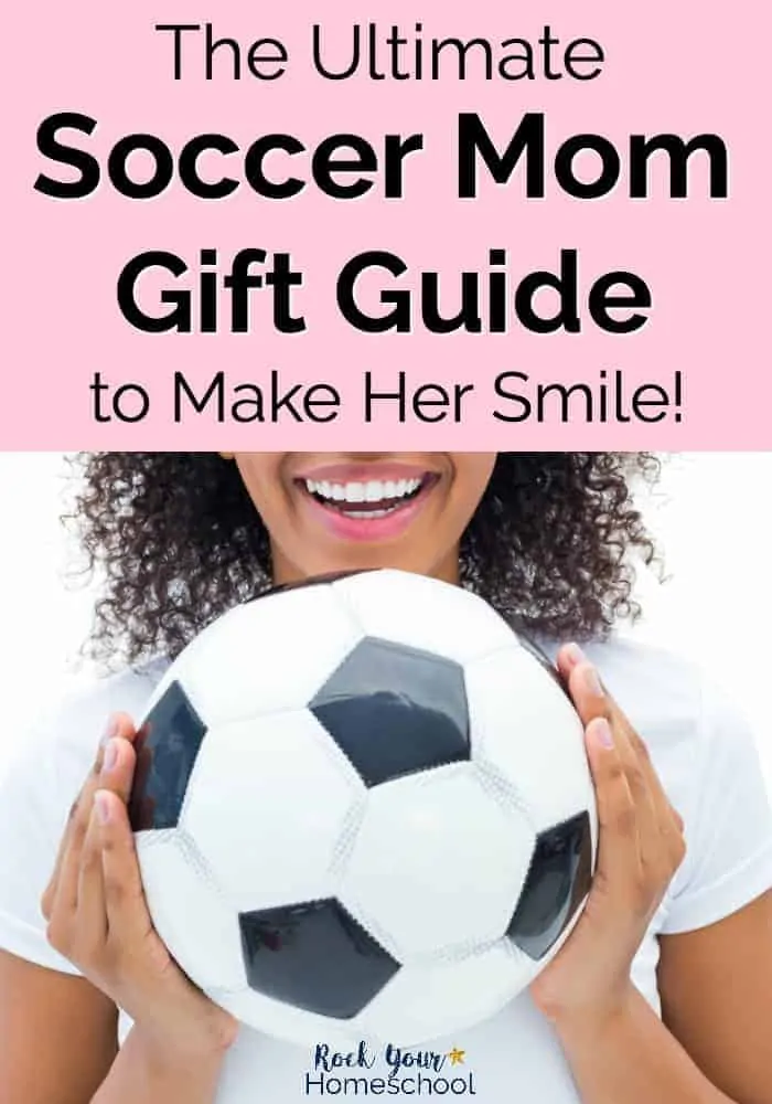 Smiling mom holding a soccer ball
