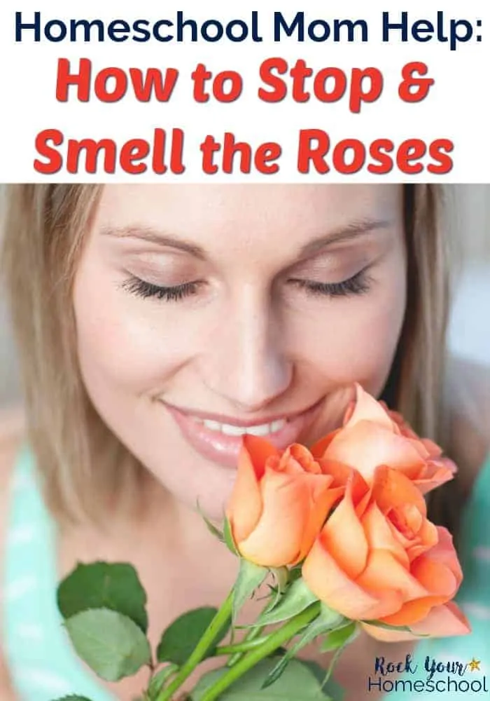 Woman with eyes closed & smiling smelling three peach roses