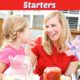 Mother & daughter wearing red shirts talking at a July picnic