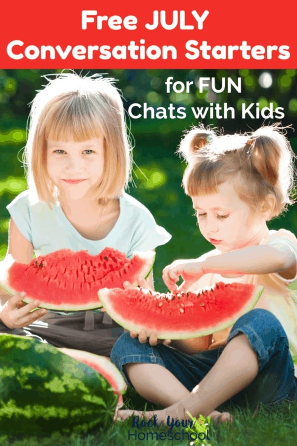 Two girls sitting on grass in the sun eating large slices of watermelon 