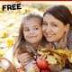 Mother & daughter holding leaves & apples as they smile while having November fun chats