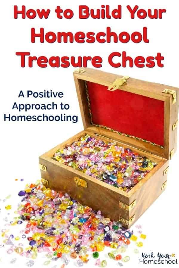 treasure chest filled with multi-colored gems & red velvet on white background