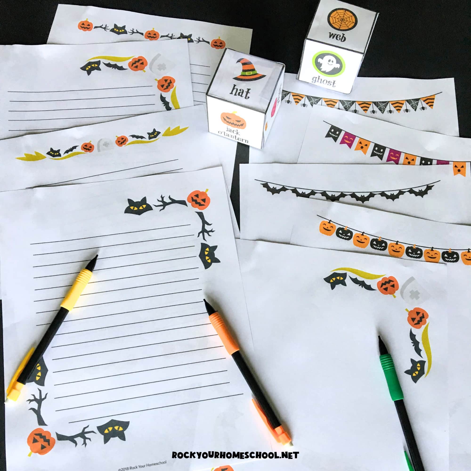 Examples of free printable Halloween writing fun pages with pencils and DIY Halloween writing prompts cube.