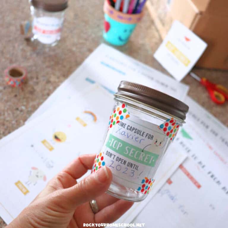 Person holding example of time capsule for kids with cute label.