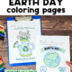 Woman holding two Earth Day coloring pages with blue clipboard, crayons, color pencils, and markers.