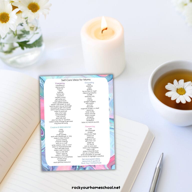 Daisy, candle, and teacup with journal and free printable list of 101 self-care ideas for moms.