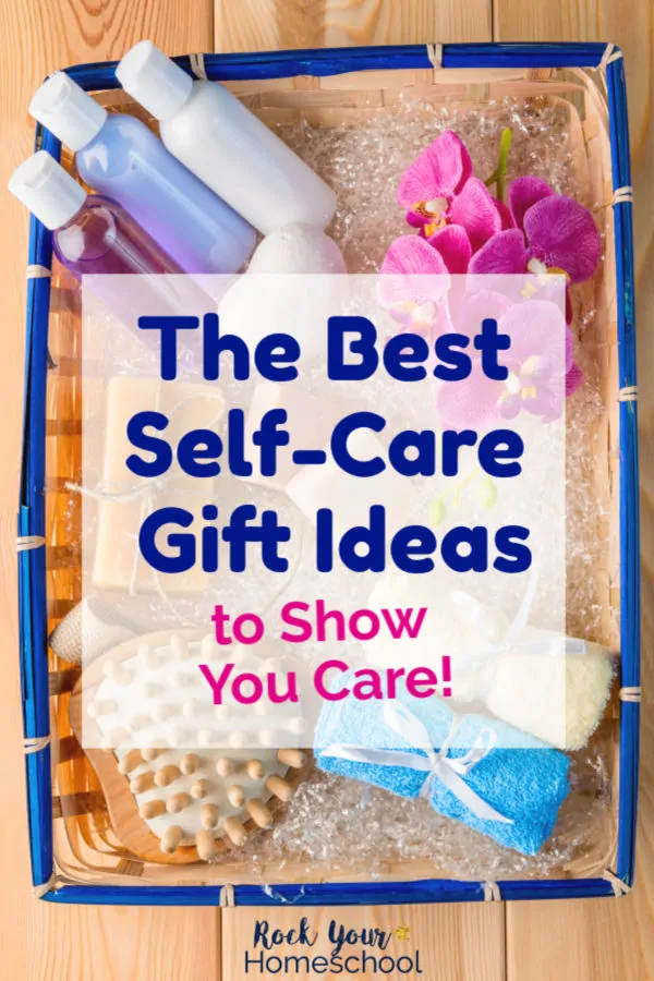 Straw basket with blue border is filled with self-care items like lotions, bath oils, shampoos, soaps, wash cloths, sponges, & flowers