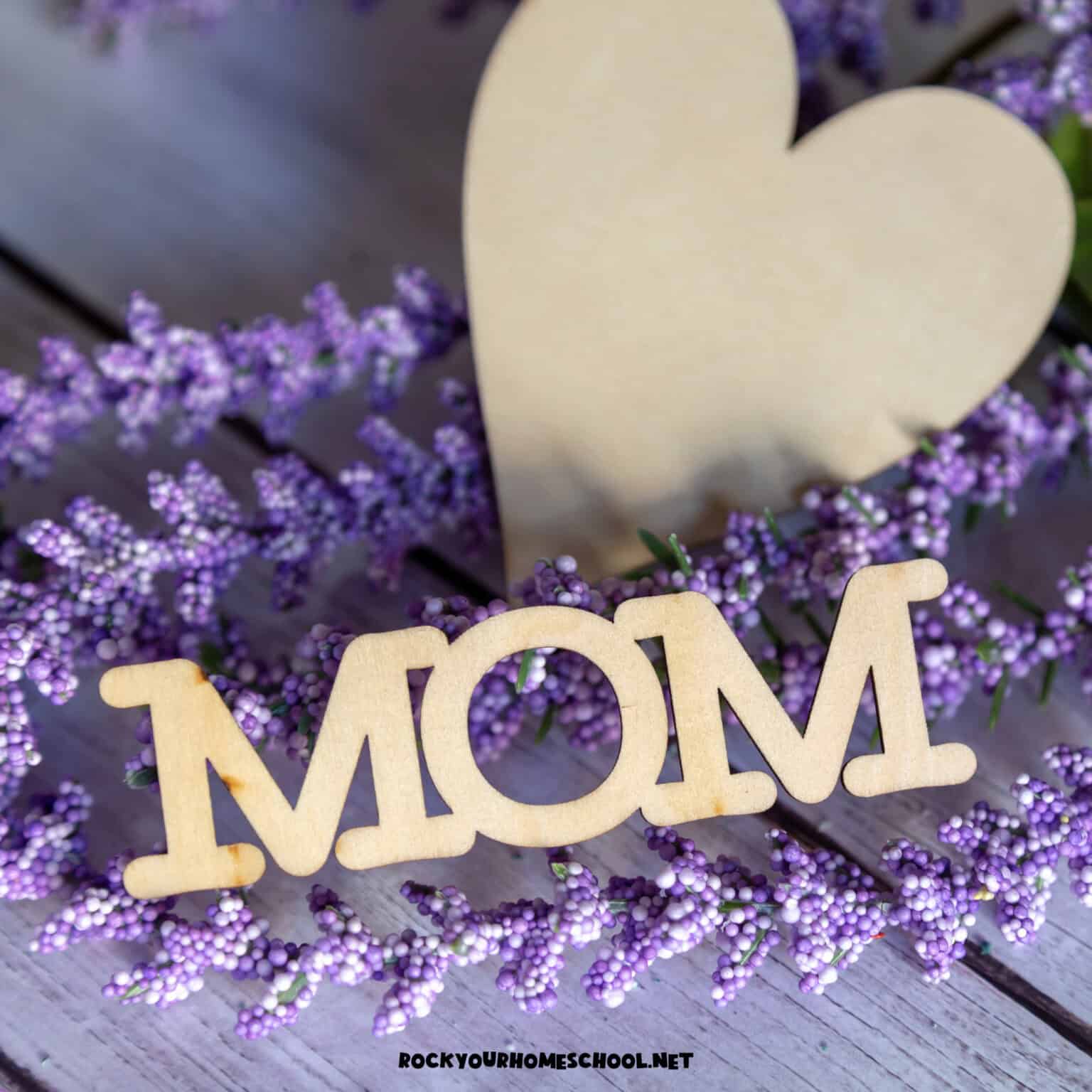Mom wood sign with wood heart and lavender to feature gift ideas for busy moms.