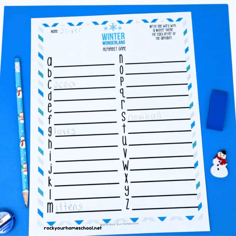 Winter Alphabet Game printable activity on blue paper with snowman pencil, snowman mini-eraser, blue eraser