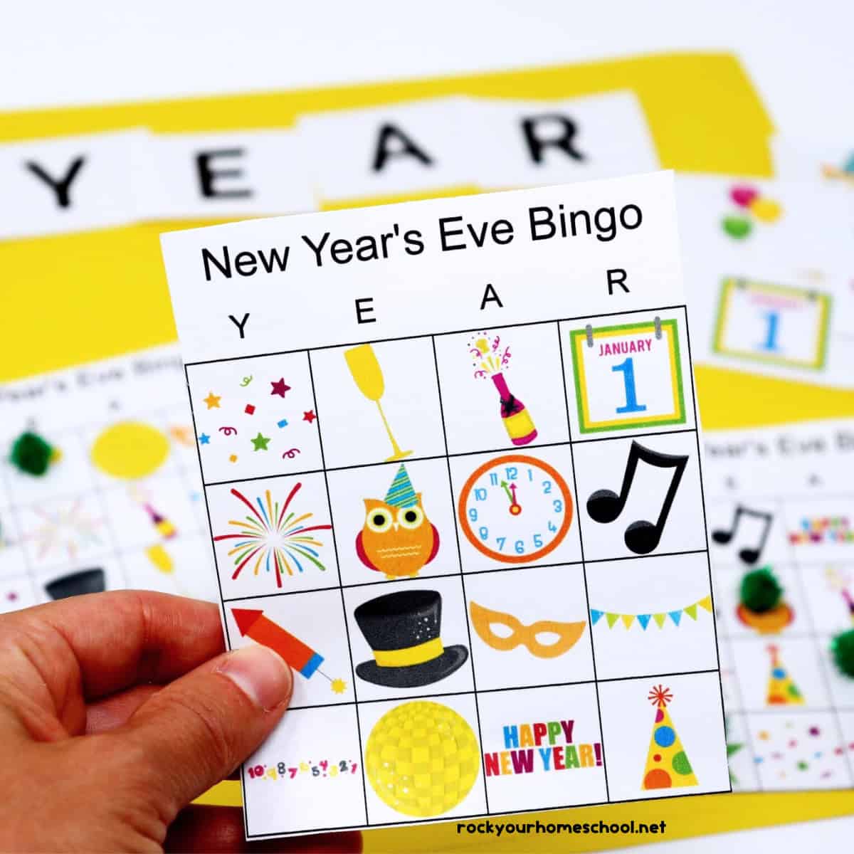 Woman holding New Year's Eve Bingo Game card with other game pieces on yellow background.