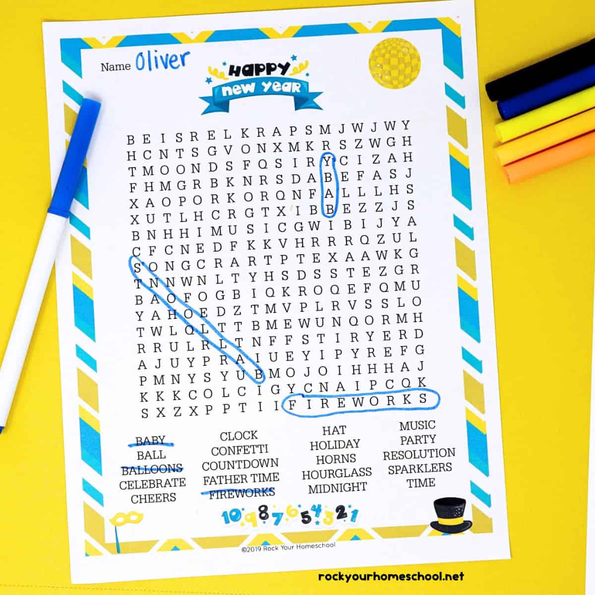 New Year's Eve Word Search with markers on yellow paper.