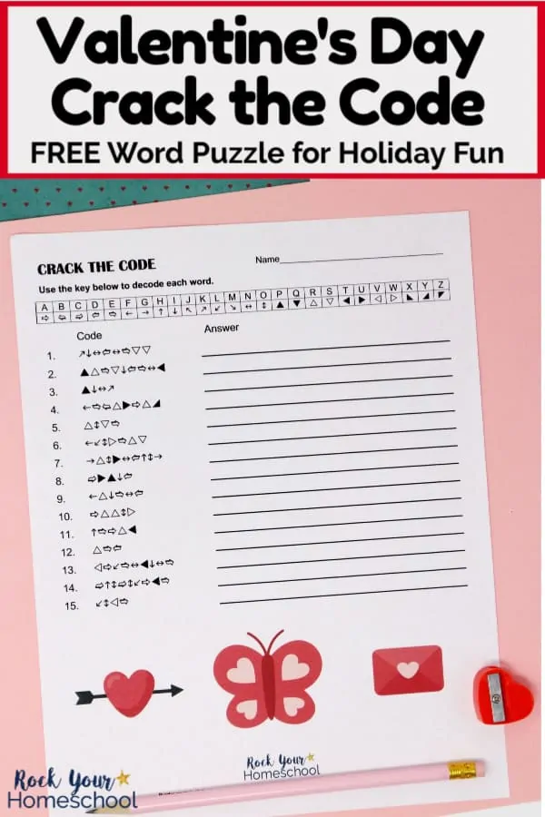 Free Valentine\'s Day Crack the Code Activity with pink pencil and red heart-shaped pencil sharpener on pink paper &amp; blue paper with tiny red hearts to feature this fun holiday activity