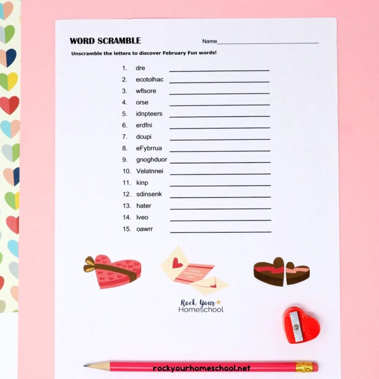 Free Valentine's Day Word Scramble printable activity with pink pencil and red heart-shaped pencil sharpener on pink paper and multi-color heart paper to feature this easy and fun holiday resource.