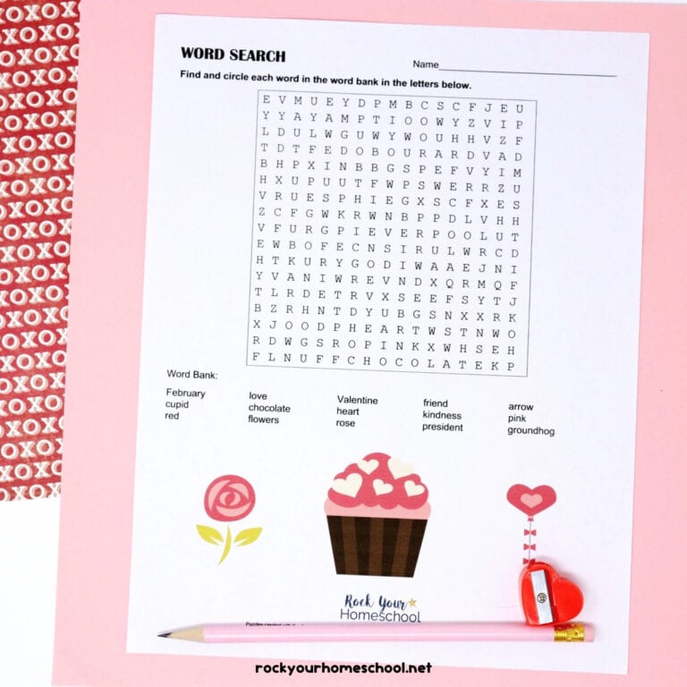 Free Valentine's Day Word Search with pink pencil and red heart-shaped pencil sharpener on pink paper.
