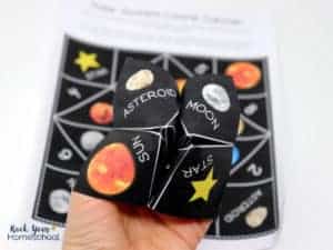 You'll have a blast with your kids using this solar system activity featuring a cootie catcher & planet fact cards for hands-on learning fun.