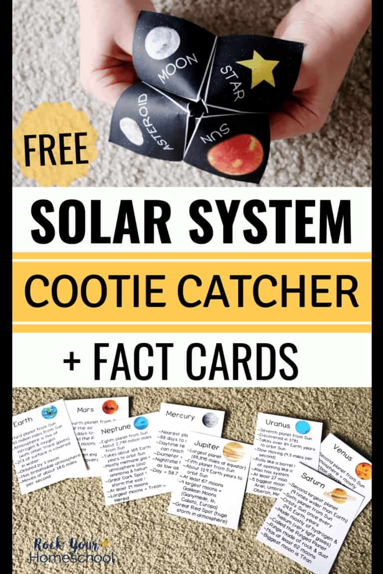 Boy holding solar system cootie catcher and planet fact cards on carpet to highlight the hands-on learning fun using this free printable solar system activity set