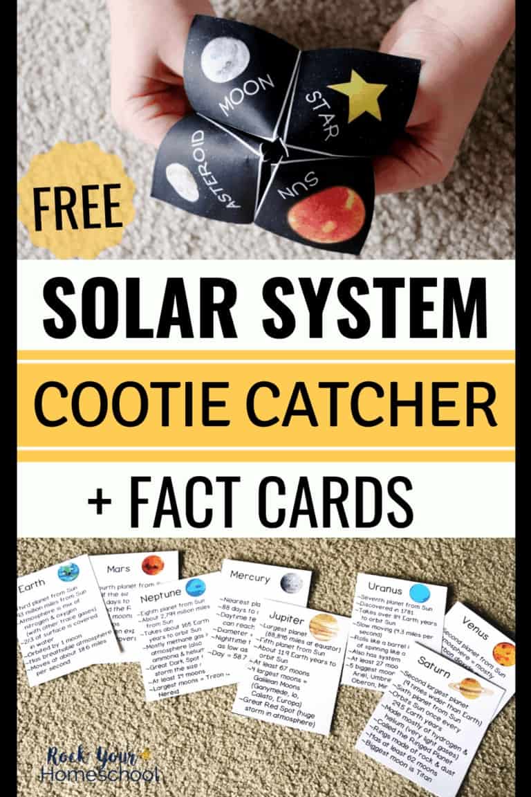 Boy holding solar system cootie catcher and planet fact cards.