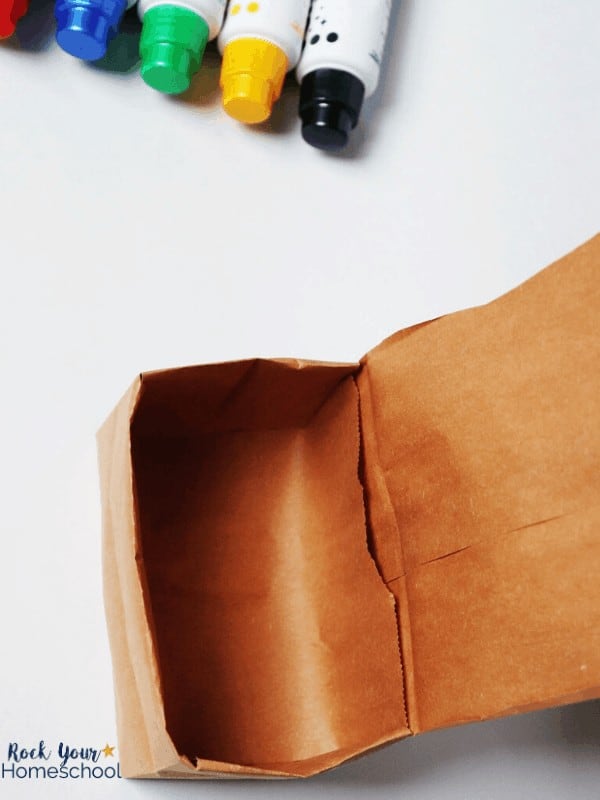 Get step-by-step instructions for making this DIY treasure box out of a brown paper lunch bag for fun things to do at home with your kids.
