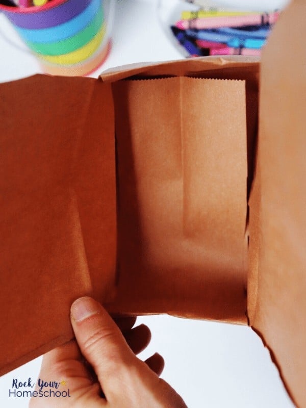 This DIY treasure box from a brown paper lunch bag is easy to make & use.