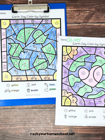 Two examples of free printable Earth Day color by symbols pages.