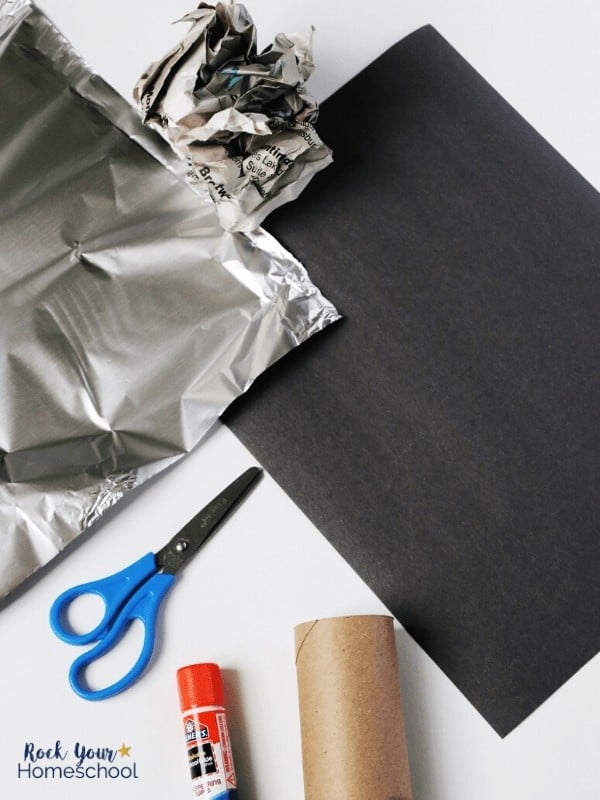 All you need to make this DIY Magic Microphone for fun things to do at home with kids are empty toilet paper roll, construction paper, scissors, glue, and aluminum foil.