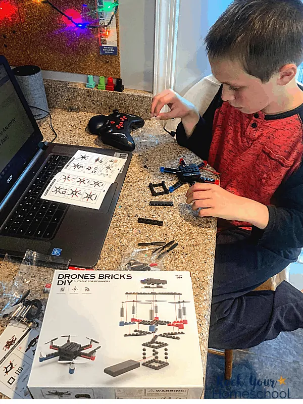 boy working on DIY drone made out of building bricks for virtual tech camp
