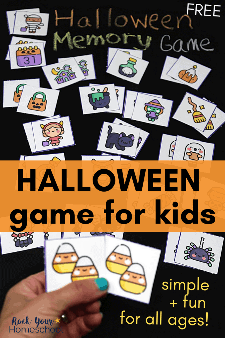 Woman holding Halloween memory game cards to feature how you can enjoy this simple free printable game with your kids for Halloween fun