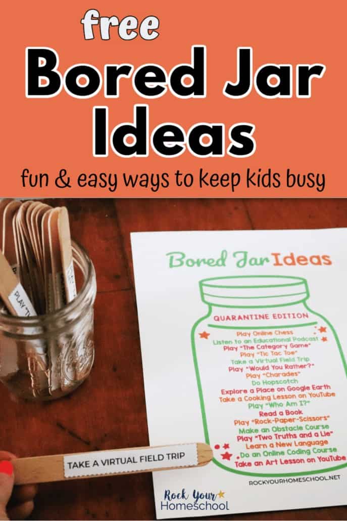 Woman holding bored jar idea on wood craft stick with jar and bored jar printable in background to feature how easy this free printable pack makes it to keep your kids busy &amp; happy