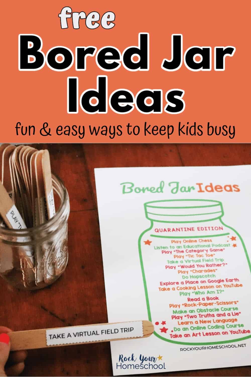 Woman holding bored jar idea on wood craft stick with jar and bored jar printable in background to feature how easy this free printable pack makes it to keep your kids busy & happy