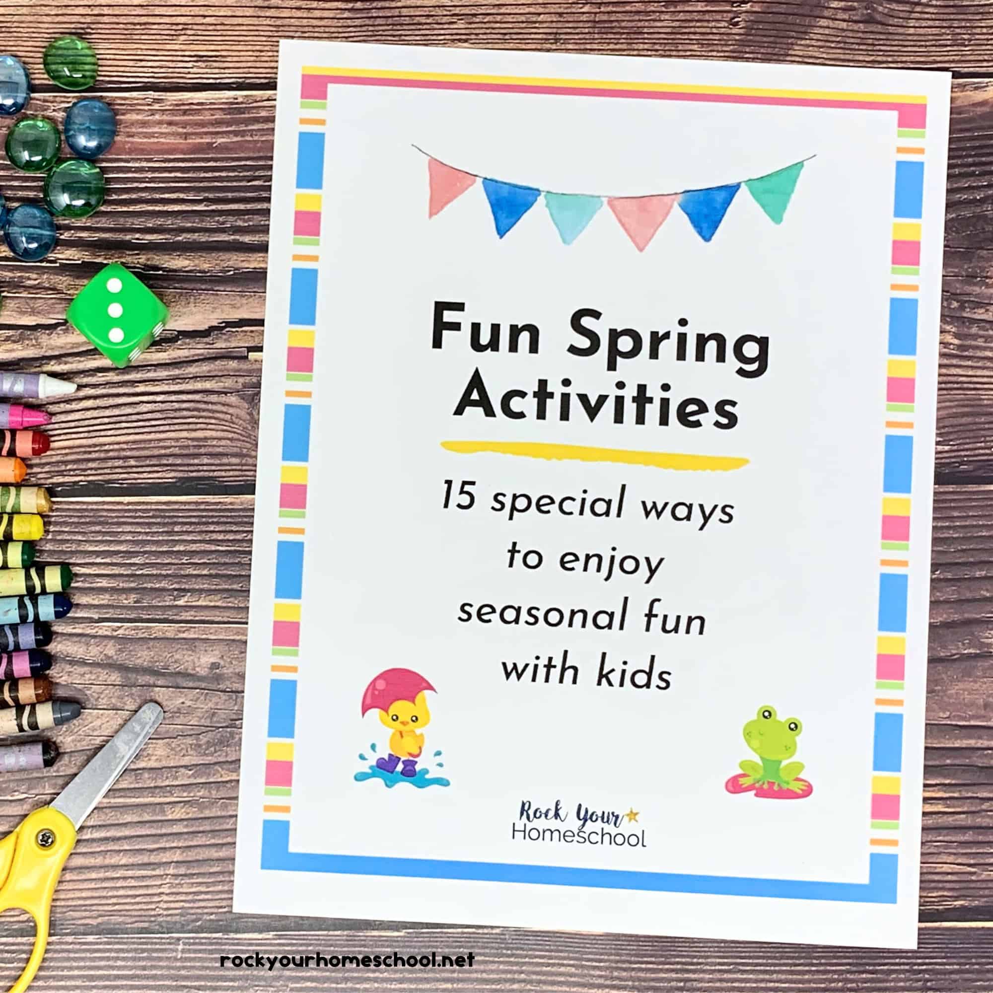 Fun Spring Activities for Kids pack cover with scissors, crayons, green dice, and blue glass floral pieces.