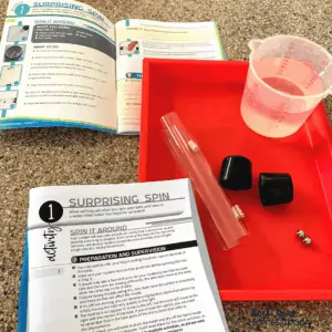 Science activity featuring Newton's first law using homeschool science kit (Science Unlocked)