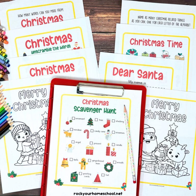 Examples of 9 free pages of Christmas activities pack on red clipboard with holiday pencil, crayons, and color pencils.