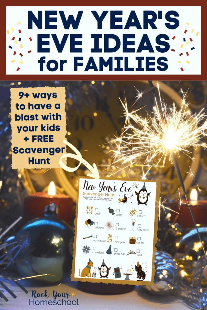 New Year's eve decor at night with sparkler, candles, and ornaments plus free printable New Year's Eve Scavenger Hunt for families