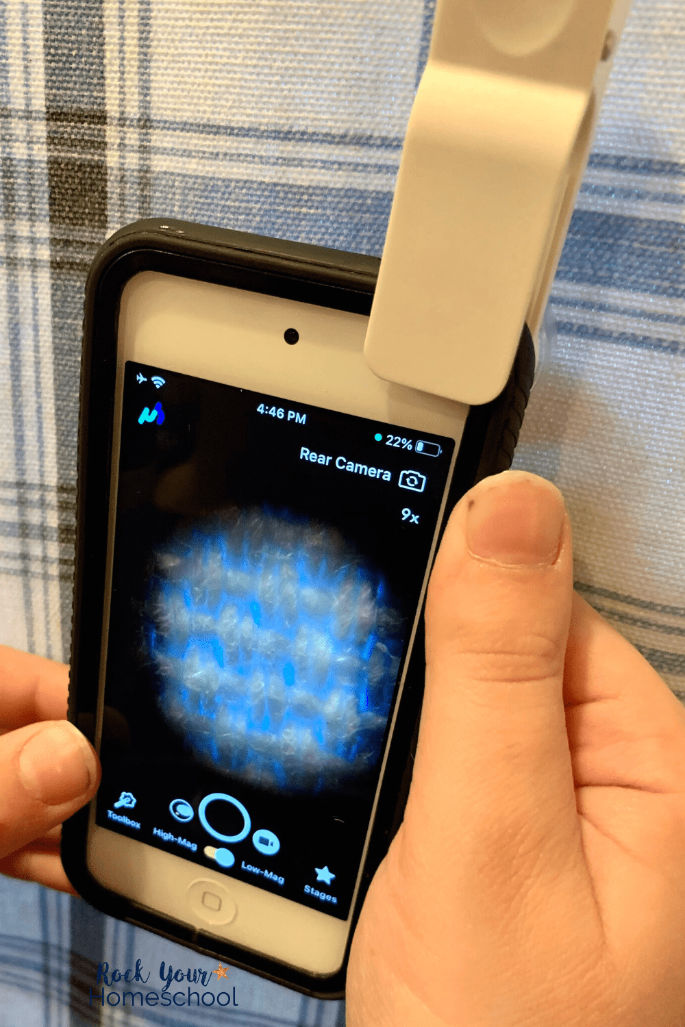 boy using uHandy mobile microscope on iPod to look at fabric