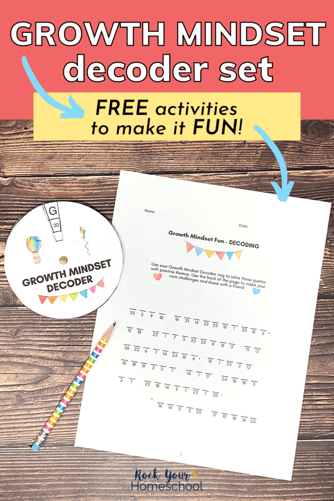 free printable growth mindset decoder ring and printable page with quote and rainbow striped pencil on wood background