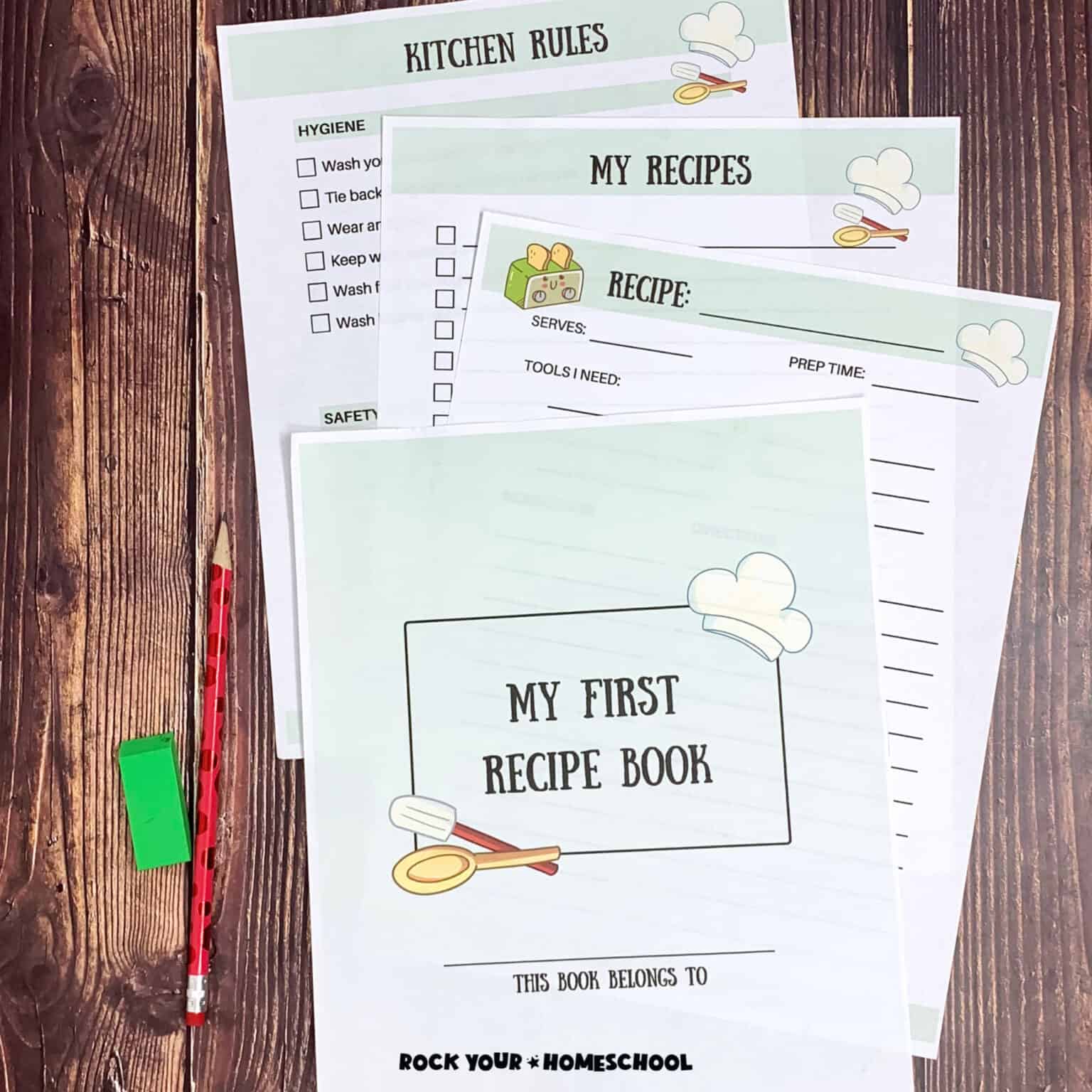 Woman holding cover page of My First Recipe Book with red pencil and green eraser on wood background with other free printable recipe book for kids pages.