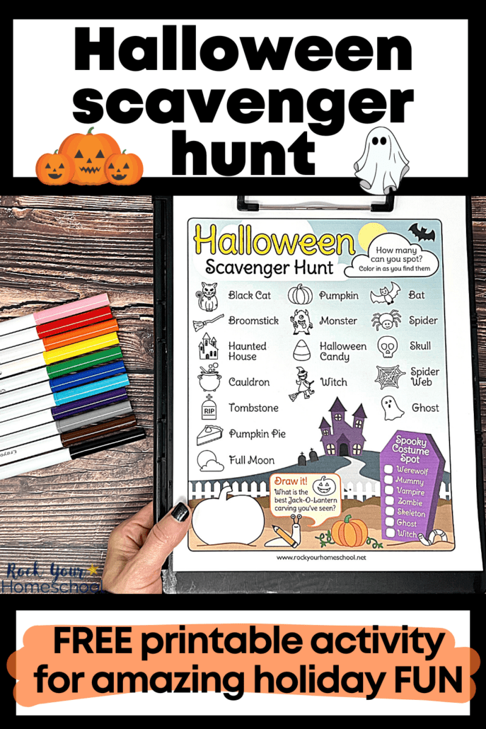 woman holding black clipboard with free printable Halloween scavenger hunt and rainbow of markers on wood background