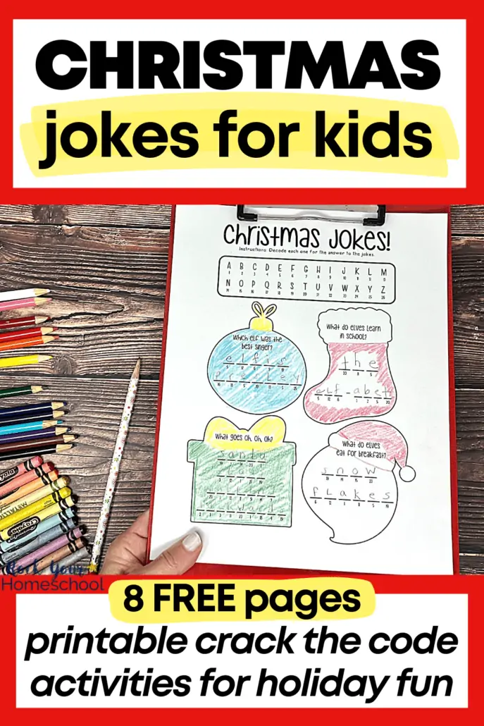 woman holding red clipboard with free printable page of Christmas jokes for kids (with crack the code activities) and color pencils, crayons, and Christmas pencil on wood background