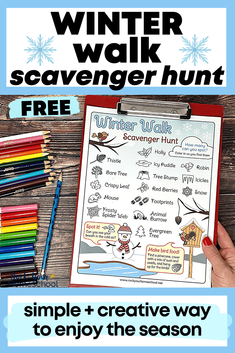woman holding red clipboard with free printable winter walk scavenger hunt activity with rainbow of markers and color pencils on wood background