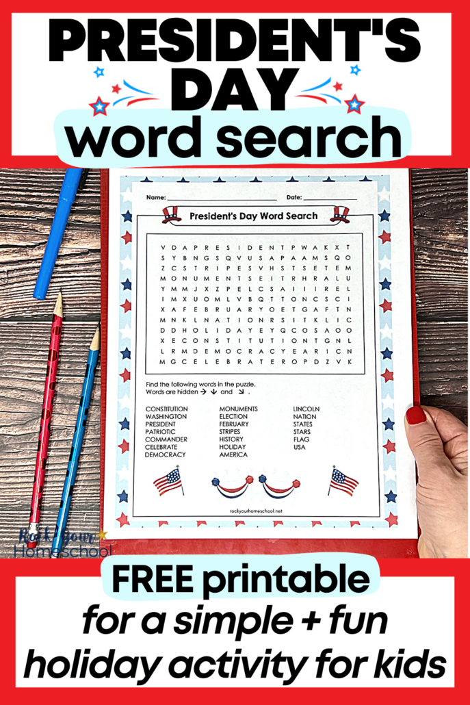 woman holding free printable President's Day word search on red clipboard with red and blue pencils and blue highlighter on wood background