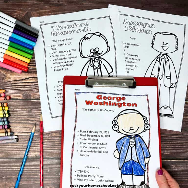 George Washington coloring page on red clipboard with Theodore Roosevelt and Joseph Biden as other examples of these free printable American Presidents coloring pages with rainbow of markers, crayons, and pencils on wood background.
