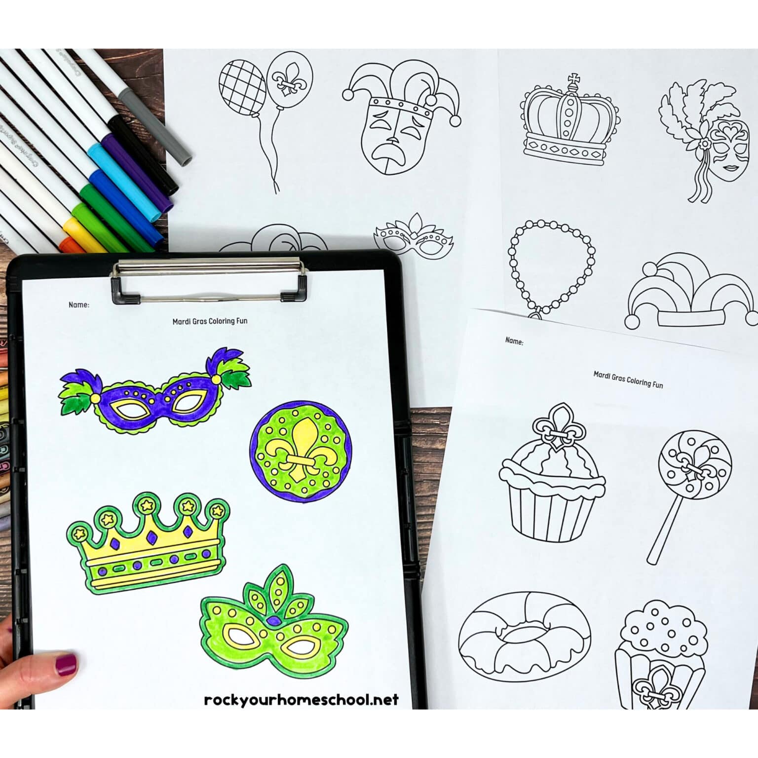 4 free printable Mardi Gras coloring pages with rainbow of markers and crayons and woman holding example on black clipboard