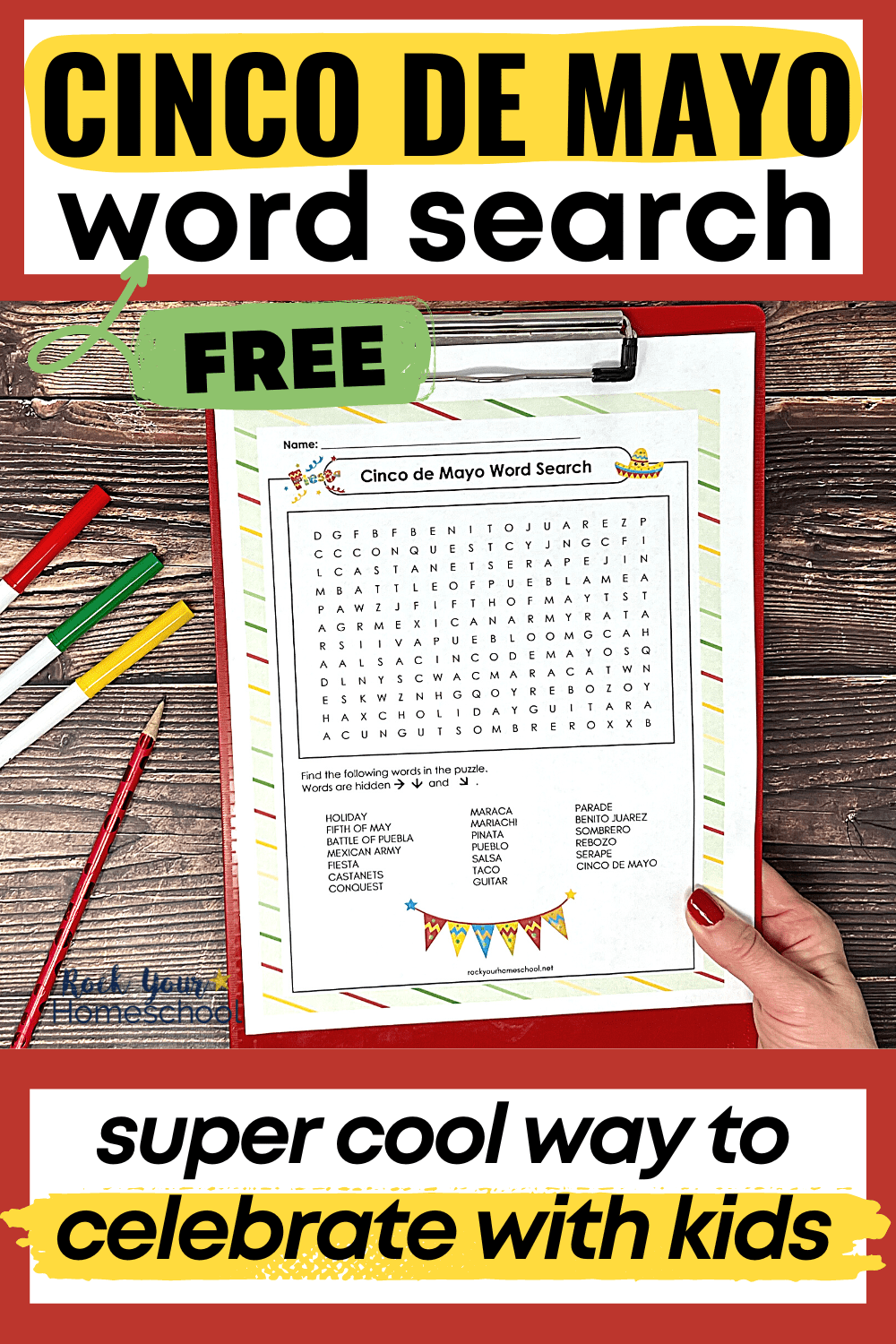 woman holding red clipboard with free printable Cinco de Mayo word search activity with markers and red pencil on wood background
