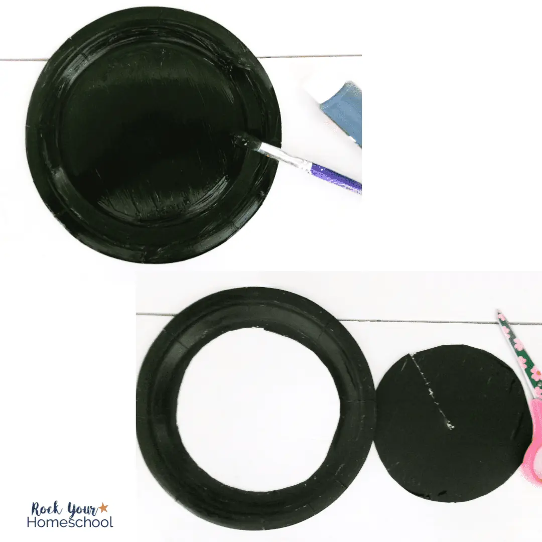 paper plate painted black and scissors for hot air balloon suncatcher craft