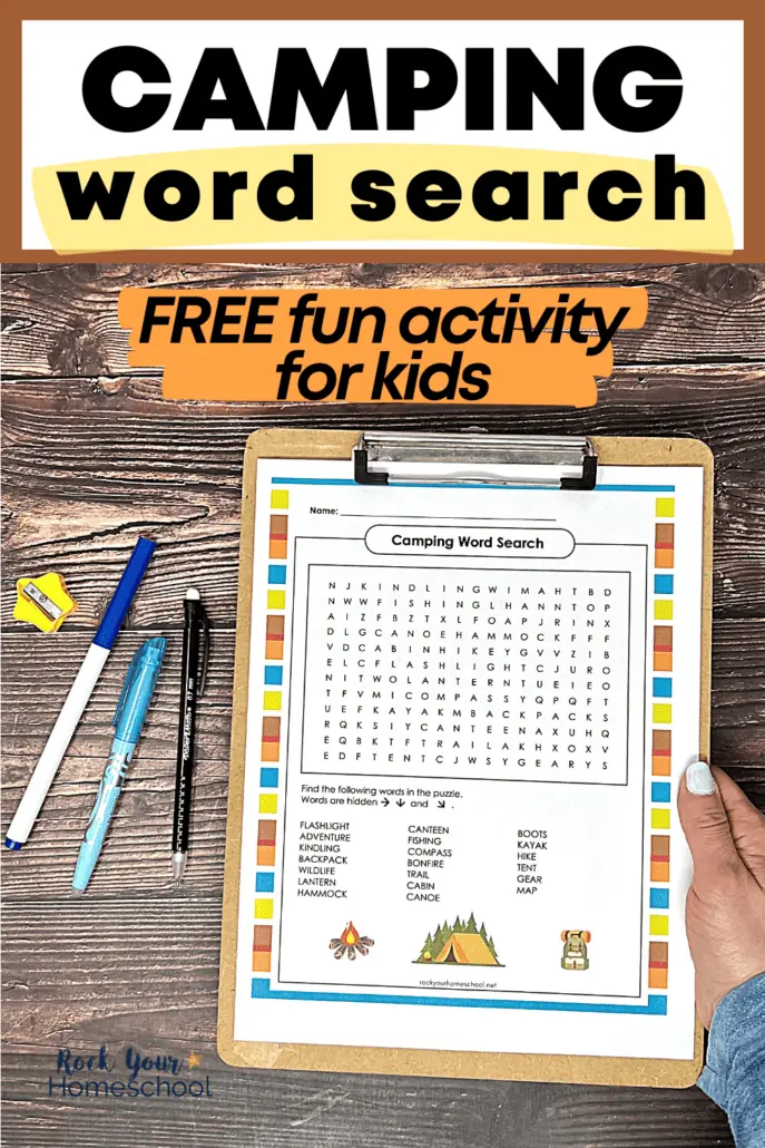 woman holding clipboard with free printable camping word search activity with pencil, marker, yellow star-shaped pencil sharpener in background